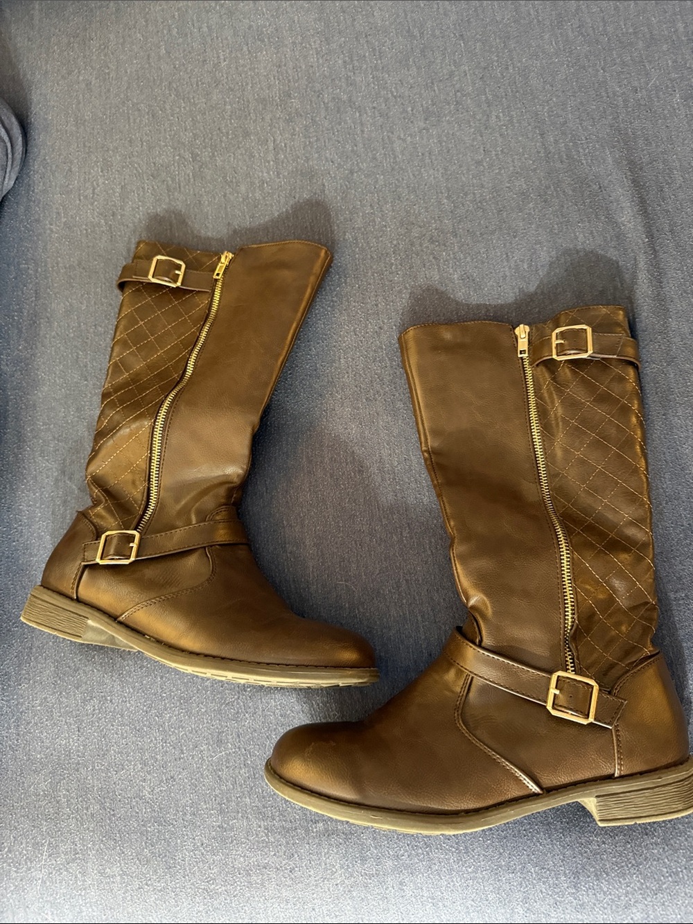 Brown boots with gold accent